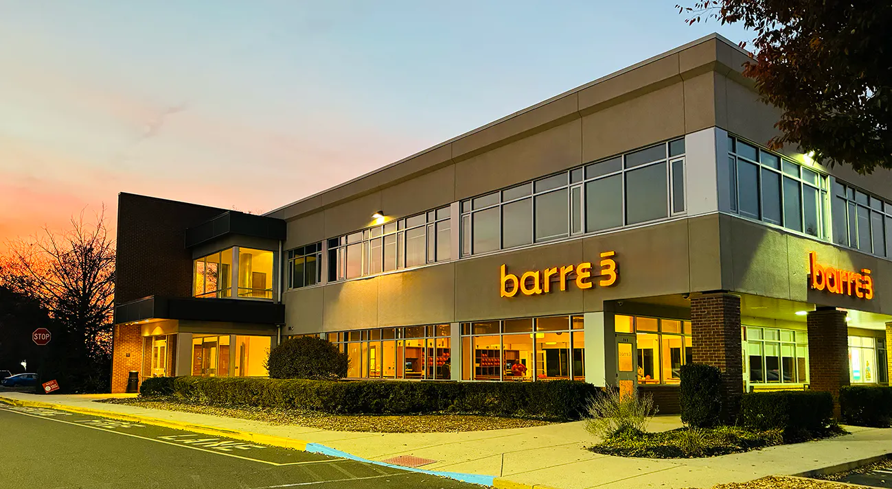 exterior of barre3 Newtown at night