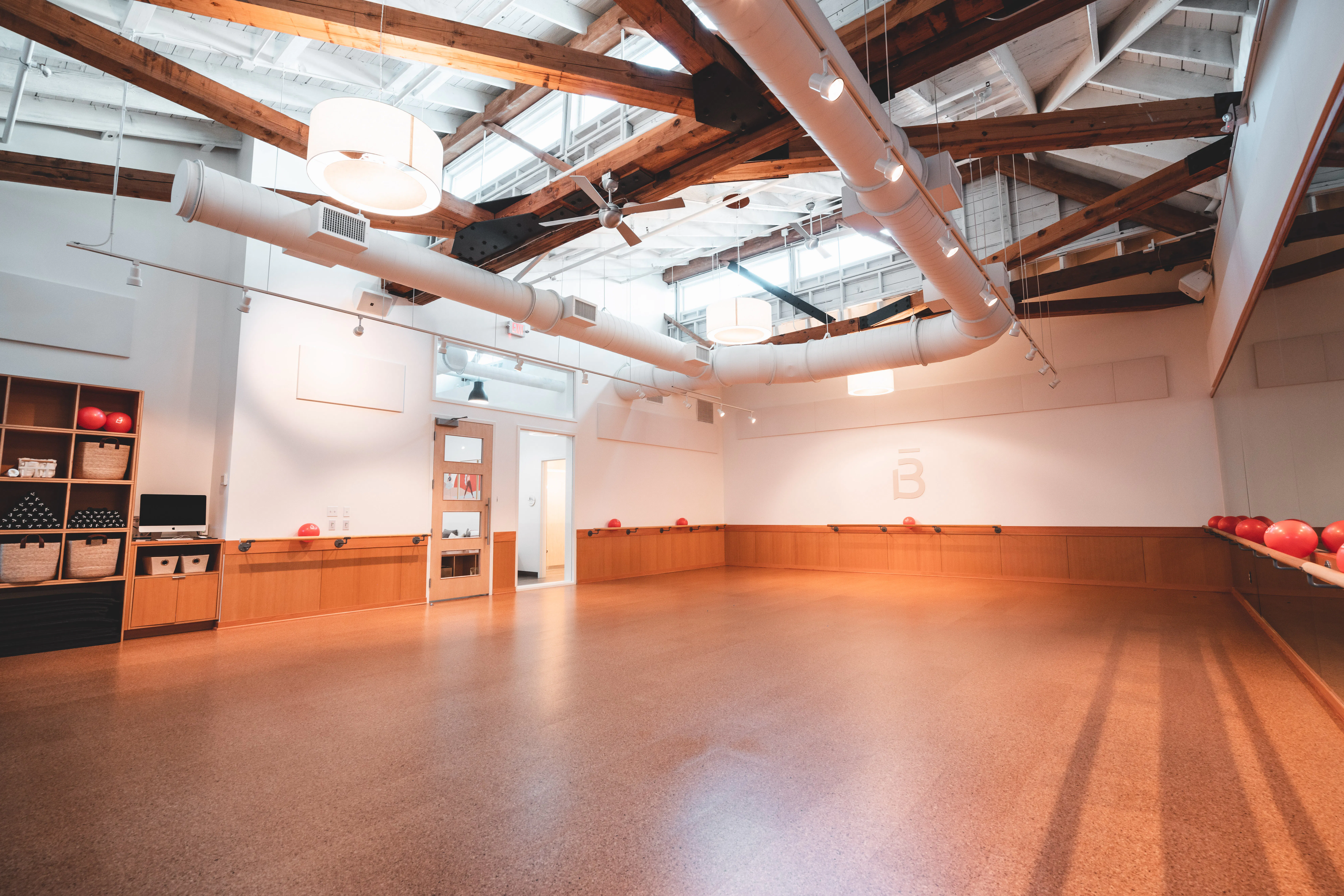 inside barre3 Edmond's studio, showing off architecture of ceiling and the spacious studio