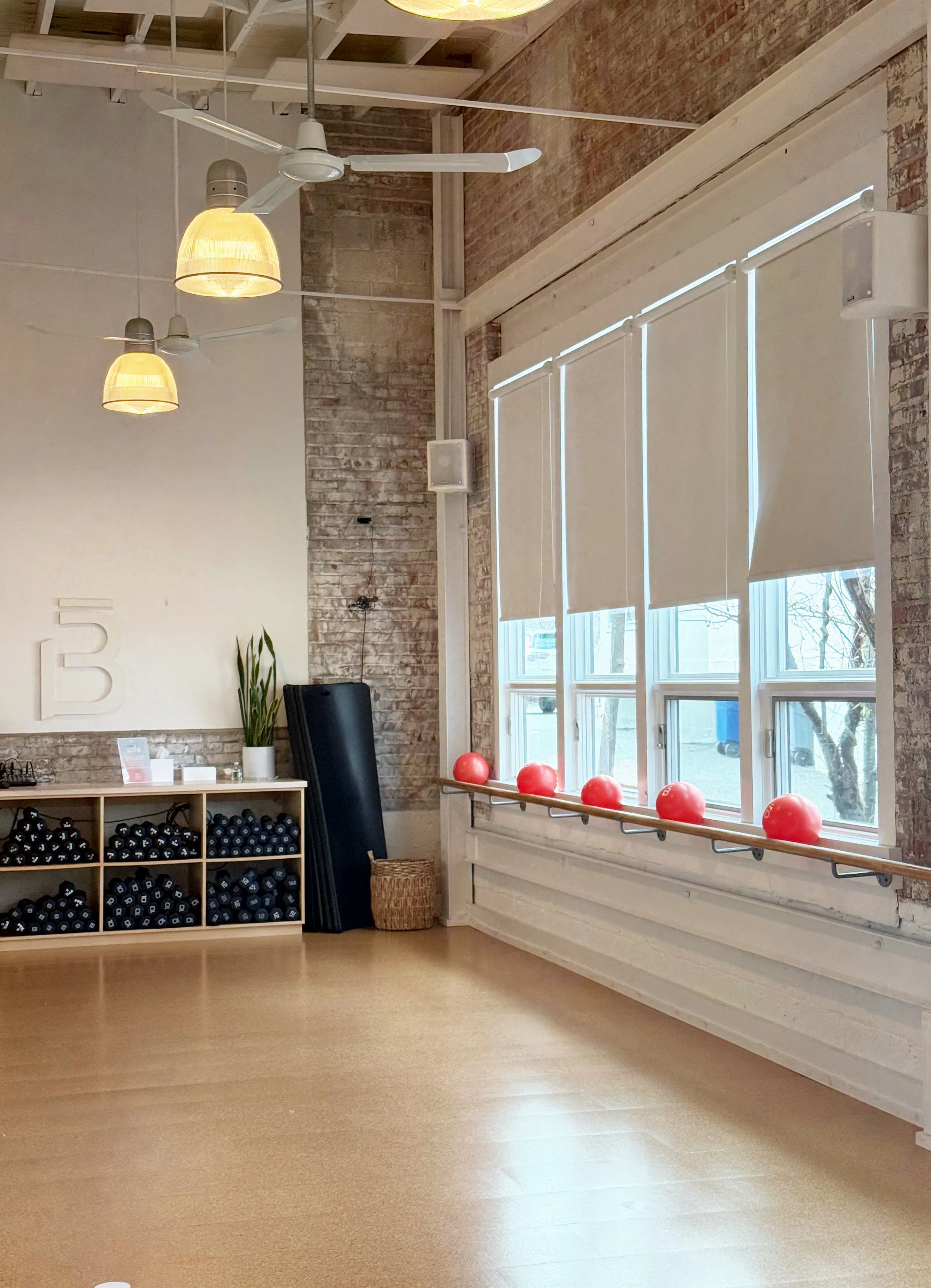 inside of the barre3 Morristown studio, looking at the windows and weight cubbies