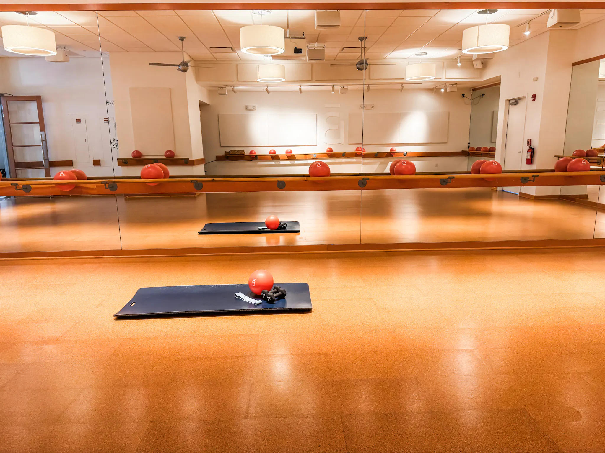 looking at the inside of the barre3 studio and a mat and core ball