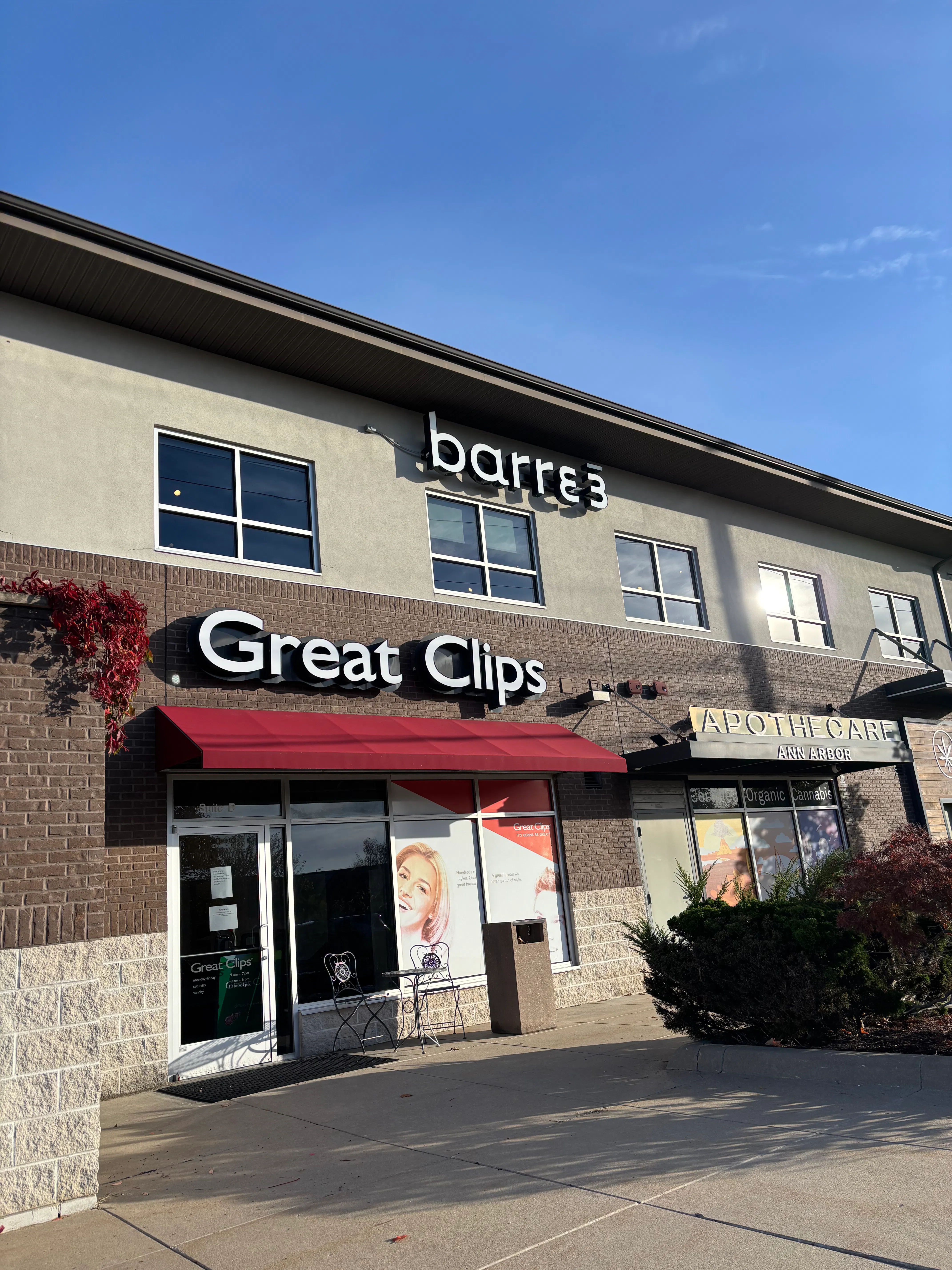 Looking to the exterior of barre3 Ann Arbor, on the second floor, above a Great Clips salon location and Apothecare Ann Arbor