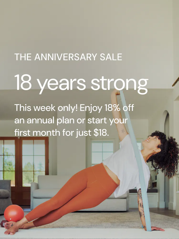 woman working out at home with weights in her hand with text saying: 18 years strong. the anniversary sale.